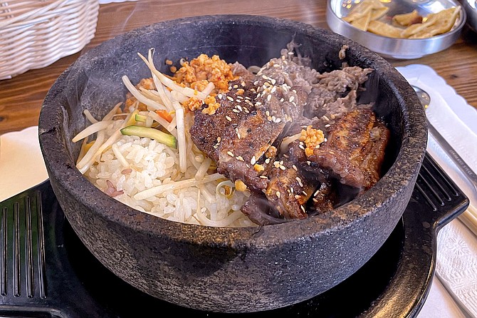 The "meat party" bibimbap, with bulgogi, short rib, and spicy chicken
