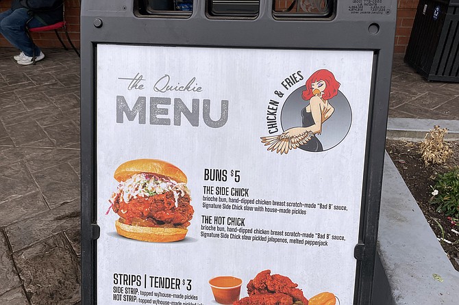 A sandwich board menu features the Side Chick logo.