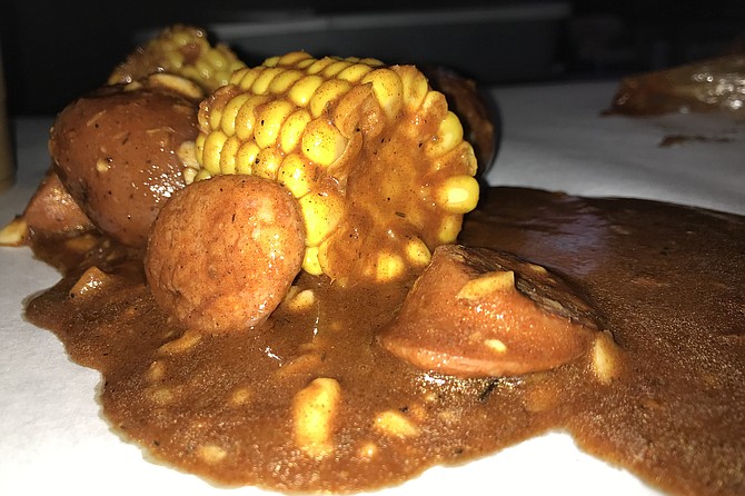 Add-ons, like this sausage, corn, potato combo, become the heart of the meal.