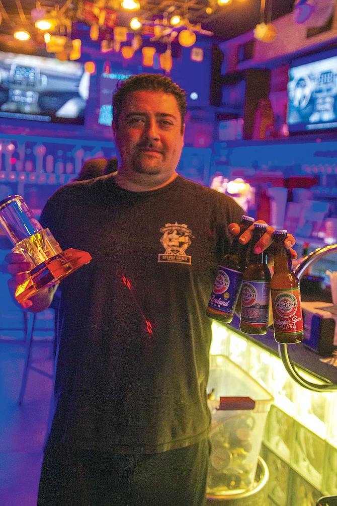 Demian Bosiger showing off his award-winning beers and trophy for Mexico’s best small brewery.