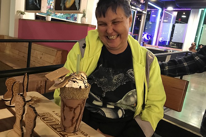 Customer Rachel deciding where to begin on her German Chocolate crazy shake.