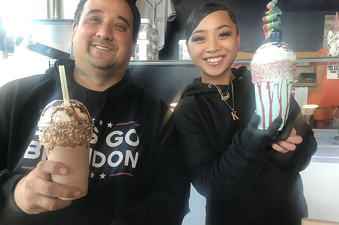 Owner Dale Stansberry and assistant Kaylani hold up a couple of crazy shakes.