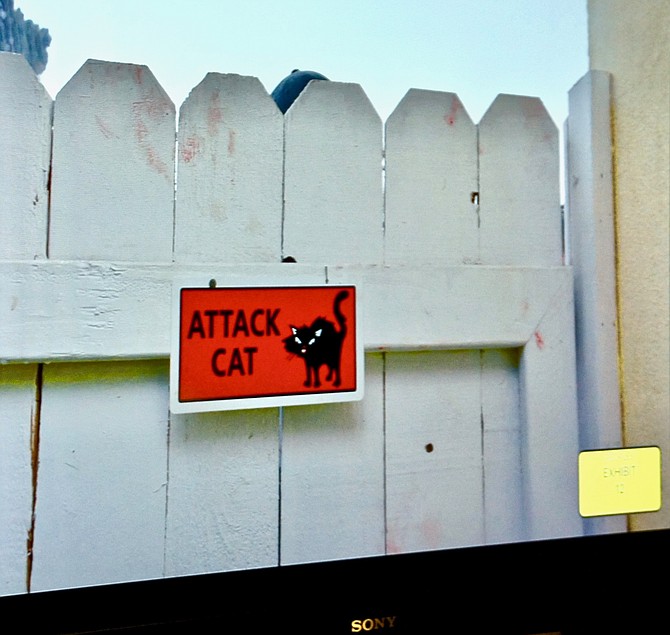 The field evidence technician collected the ATTACK CAT sign because it had a good fingerprint on it.