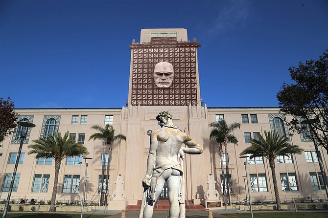 The County Administration Building, newly adorned with the former facade of the Palazzo Braschi, which once served as Mussolini’s Fascist Headquarters in Rome. In front, a statue of Hercules, purchased from the Foro Mussolini. “I don’t see what all the fuss is about,” protests Stephan. “‘Si’ just means ‘Yes’ in Spanish, and that reflects the positive, can-do spirit of San Diego government. At the same time, I acknowledge that pursuing justice in a diverse city like San Diego is, like cleaning out the Aegean stables, a Herculean task.”