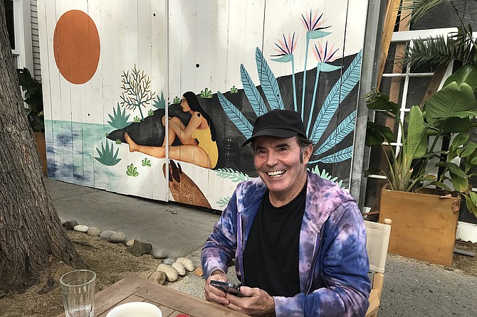 Neighbor Kevin, happy camper after disposing of Breaky Burrito ($11.50) in cafe garden