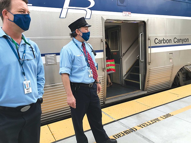 Conductors await Surfliner passengers. “Cold? Have you tried Boston?”