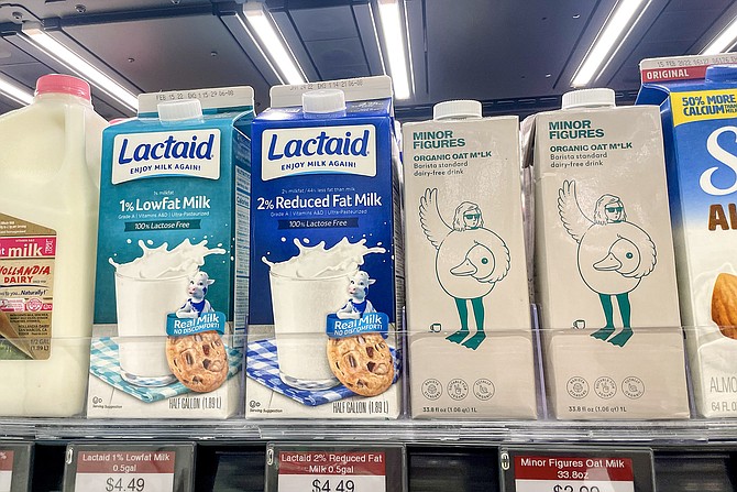 Above the milk, lights and sensors track which items have been removed from, or replaced on, the shelf.