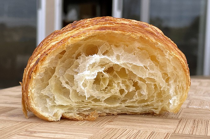 A cross section of the plain croissant served by The French Oven
