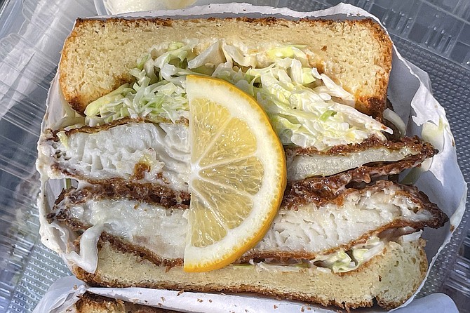 Panko encrusted tilapia with coleslaw on milk bread