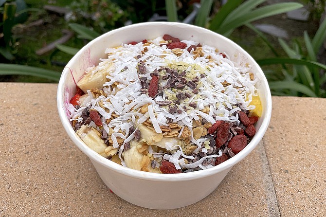 The premium bowl, loaded with superfoods: acai, pitaya, goji berries, hemp seeds, cacao nibs, and more.