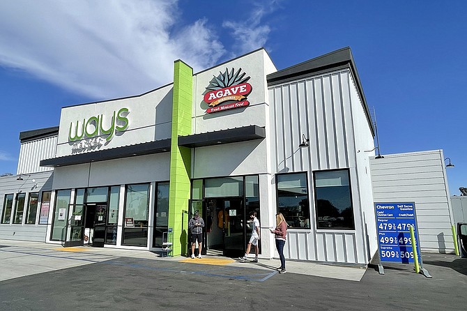 An Encinitas gas station has a convenience store on one side, a birrería on the other.