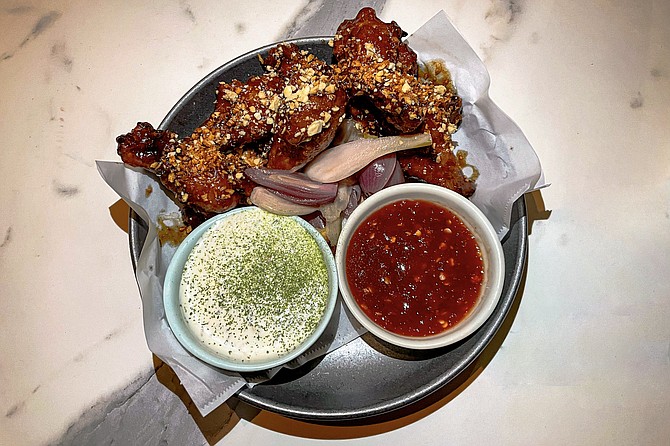 Tangy chicken wings, courtesy of tamarind glaze, with coconut ranch dipping sauce
