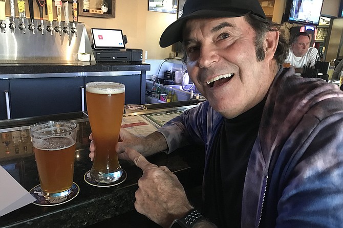 Neighbor goes for the biggie size - sports bar specialty.