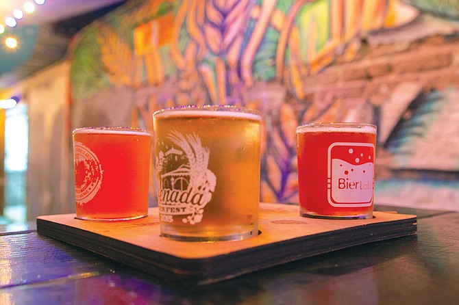 A flight of Canneria Cervecería out in the patio.