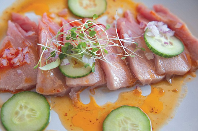 Agua Mala’s tiradito de atun: $9 for a plate of tuna drenched in serrano oil, cherry tomatoes, dashi, ginger, and Persian cucumbers, a combination that brought me delight.