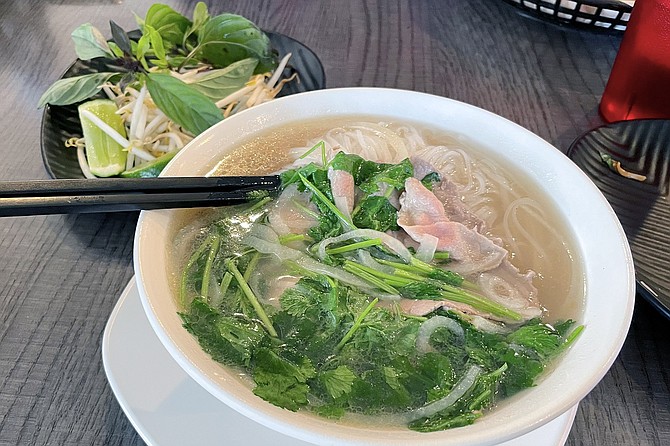 Rare beef phở, in a clear, ten-hour broth