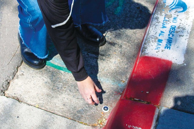We walked up and down the road, looking for the tag. After a few minutes, Nicole shouted, “I found it!” There in her hand was my white apple air tag.