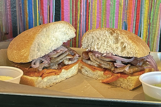 The chicharron sandwich, featuring braised pork and sweet potatoes