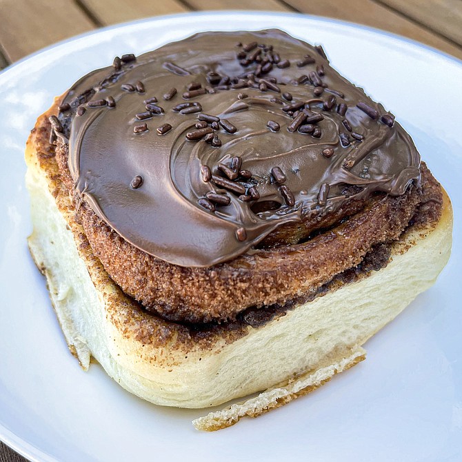 Cinnamon roll topped by Nutella spread