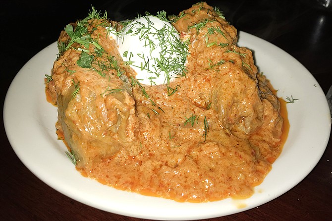 Hidden inside, two “Ukrainian burritos,” cabbage leaves stuffed with meats, spices.