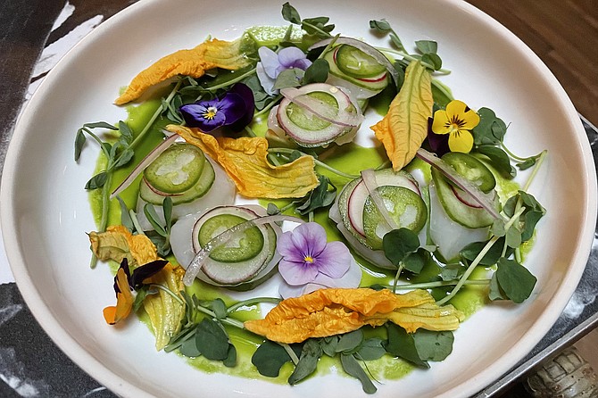 Scallop aguachile with squash blossoms and edible flowers
