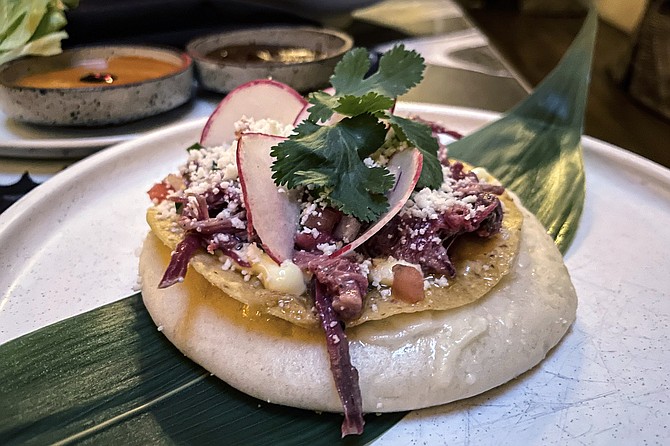 The "crispy gordita", a crunchy corn tostada stuck to the top of a steamed bun