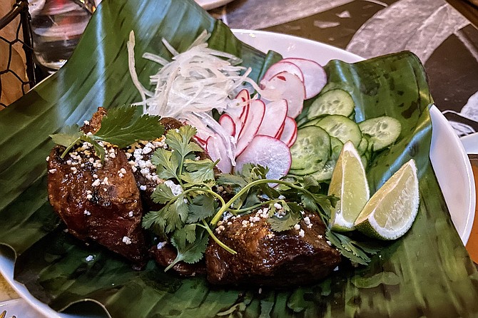 This well-cooked lamb shoulder barbacoa doesn't need the taco fixins it's served with.