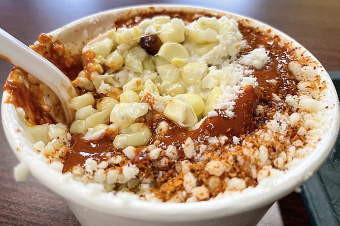 Esquites, a corn salad popularly served by street vendors in cities of Mexico