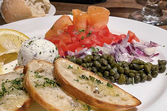A smoked salmon appetizer modeled after a popular bagel shop order