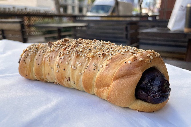 A bacon, cheddar, jalapeño sausage wrapped in kolache dough may be better known as a pig in a blanket
