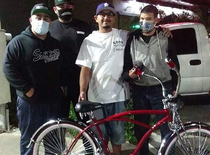 Robert McKinley, Anthony Garcia and Juan Cordero customized a lowrider bike for Juju (far right).