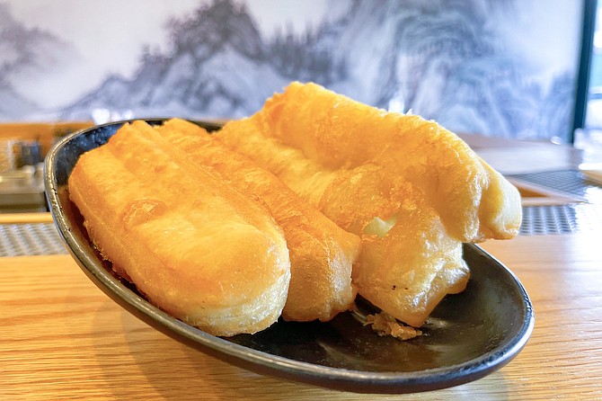 These crullers are neither French nor sweet: they're savory youtiao, sometimes called Chinese donuts.