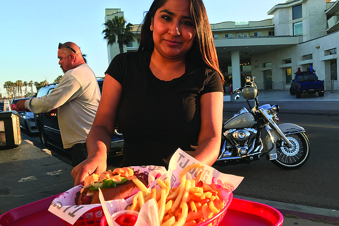 Danny (background) gets his carne asada dog and fries.