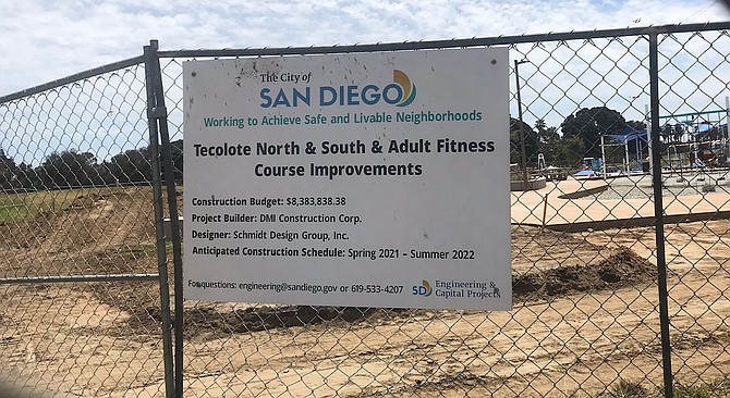 The signage states the new playground and fitness course and bathrooms are slated to be completed by the end of the month.