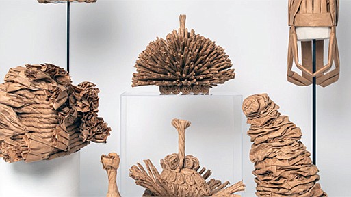 FOLD, TWIST, TIE features whimsical and sculptural paper hats made by self-taught artist, moses.