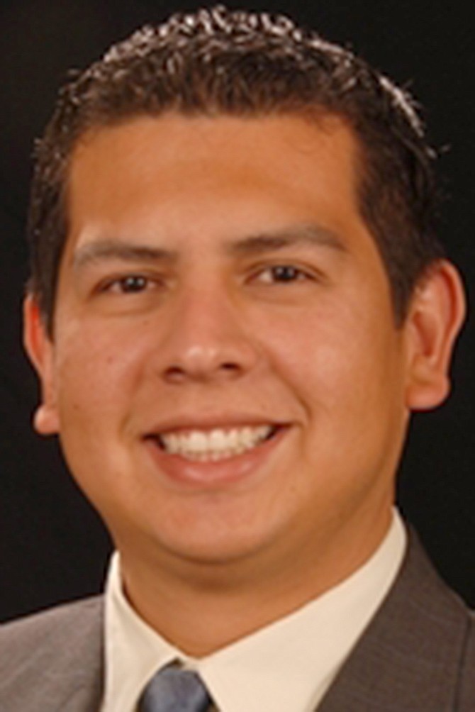Why is this man smiling? Because major corporations oppose his opponent!