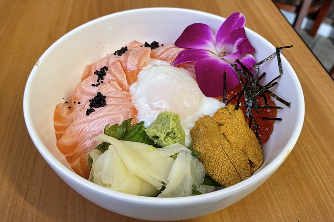 The salmon and uni rice bowl, with poached chicken egg and two types of roe