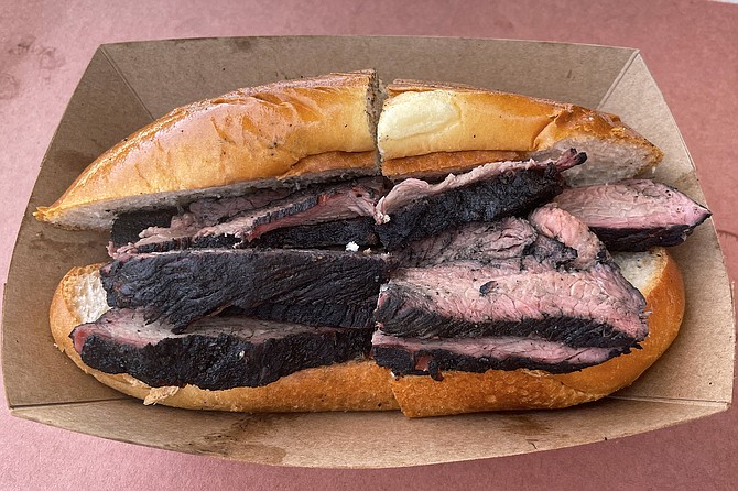 An undressed tri tip sandwich from Grand Ole BBQ y Asado