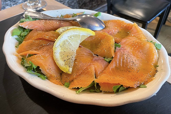 A generous portion of salmon for a carpaccio appetizer
