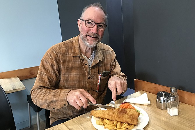 My Kiwi buddy Russell attacks his Blue Cod dinner
