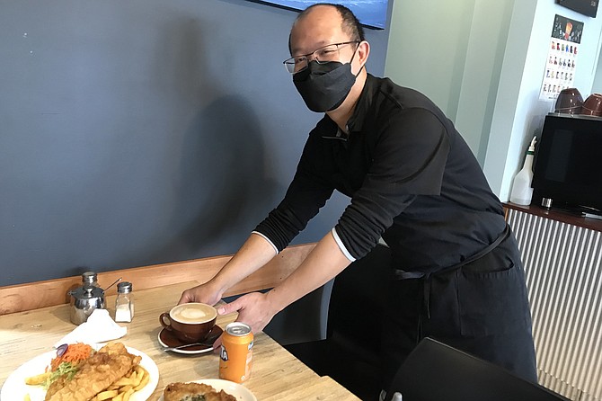 Owner Jerry brings “Flat White” coffee for Russell