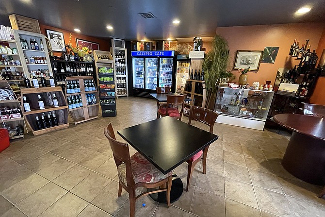 A market and deli counter with coffee, teas, wine, beer, and a host of specialty soft drinks