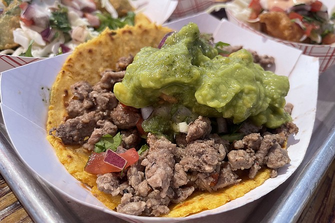 Carne asada taco, with pinto beans and guacamole