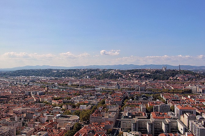 The sprawling city of Lyon, with the old quarter and hilltops of Fourvière in the distance.