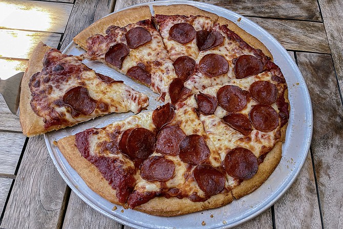 The traditional crust pizza provides an easier way to conquer alternative to deep dish.