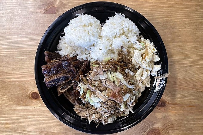 A plate lunch loaded with kalua pork and kalbi short ribs