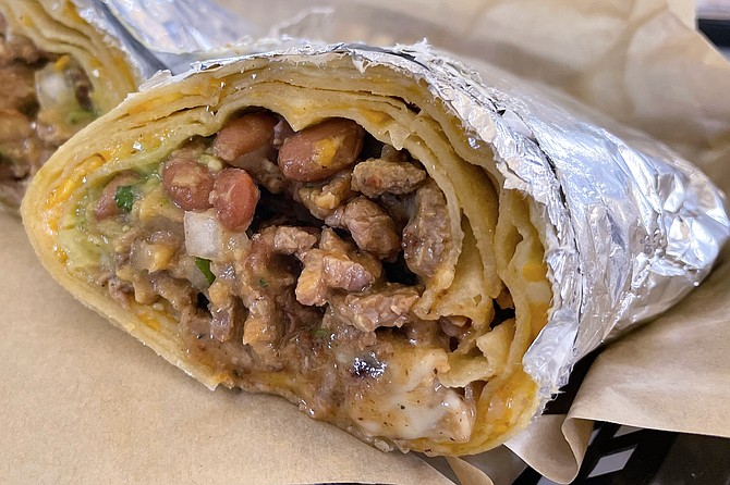 A Bad Hombres quesarito, a burrito rolled up with a large quesadilla
