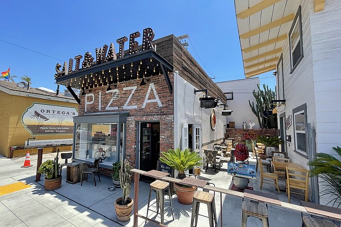 A tiny pizza shop with all-outdoor seating at the west end of Hillcrest
