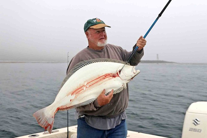 Joe Martin with a nice halibut caught on the lee side of San Martin Island while fishing with Captain Juan Cook.