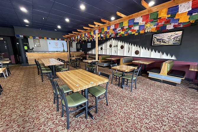 Prayer flags decorate the interior of The Dancing Yak.